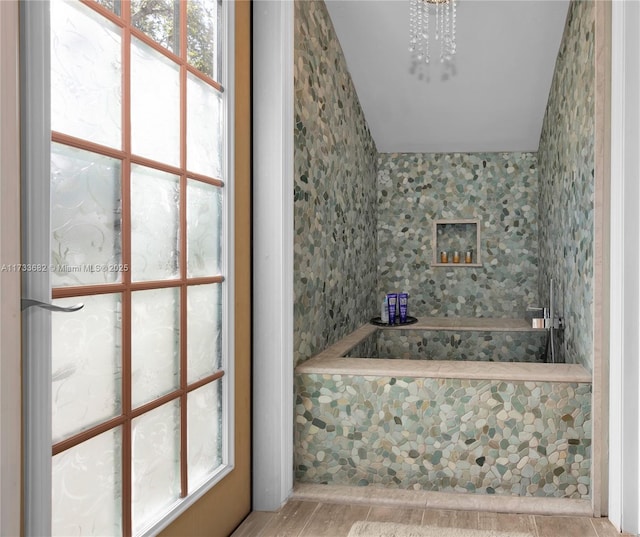 bathroom with an inviting chandelier