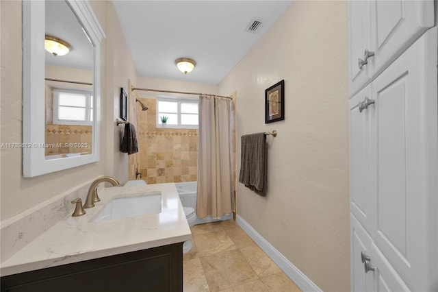 full bathroom featuring vanity, tile patterned floors, shower / bath combination with curtain, and toilet