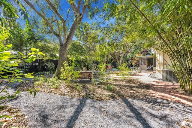 view of yard featuring a sunroom