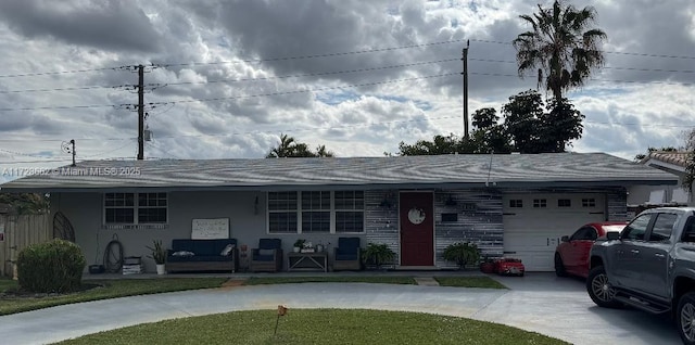 ranch-style home with a garage