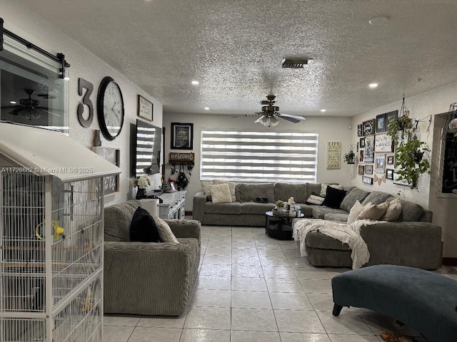 tiled living room with a textured ceiling and ceiling fan