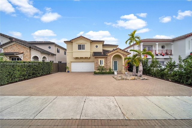 mediterranean / spanish-style home featuring a garage