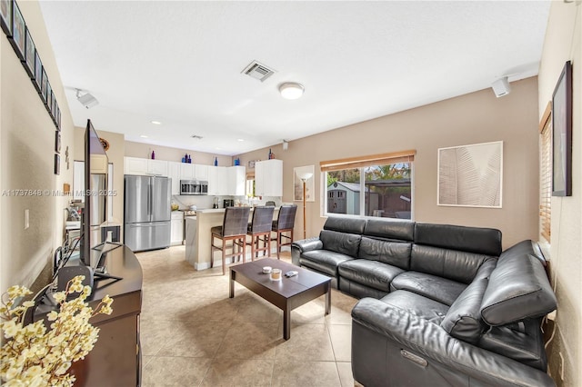 living room featuring light tile patterned floors