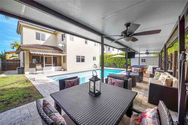 exterior space featuring outdoor lounge area, a patio, and ceiling fan