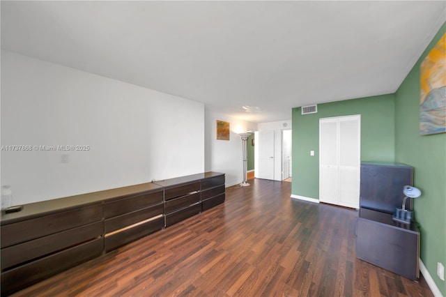 spare room featuring dark hardwood / wood-style flooring