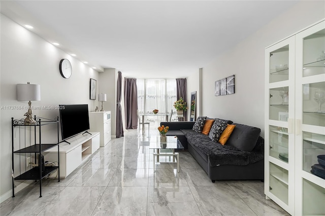 living room featuring floor to ceiling windows