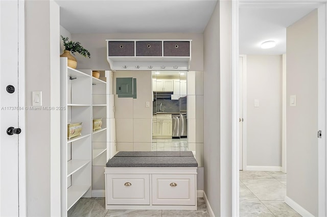 mudroom featuring sink and electric panel