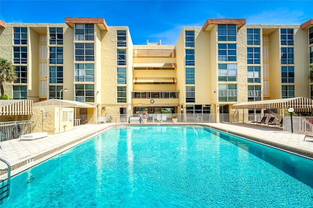 view of swimming pool with a patio area