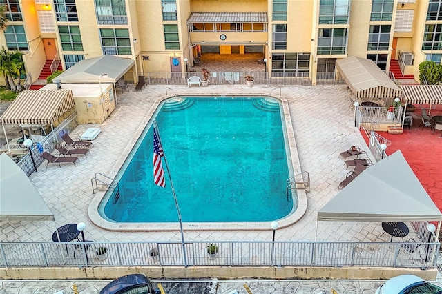 view of swimming pool featuring a patio