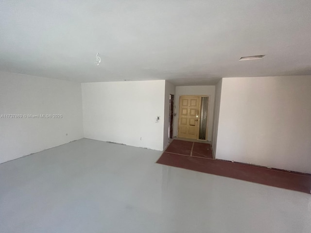 empty room featuring concrete floors