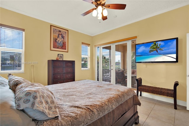 bedroom with access to exterior, light tile patterned floors, ornamental molding, ceiling fan, and baseboards