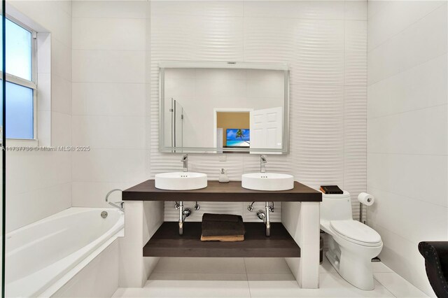 full bathroom featuring vanity, tile walls, tile patterned floors, and toilet