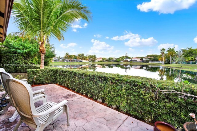 view of patio with a water view