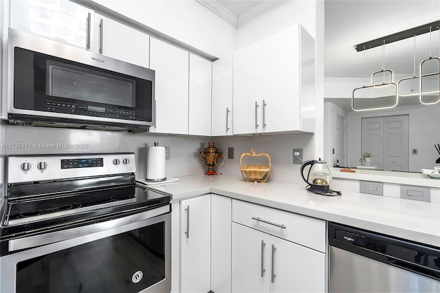 kitchen featuring ornamental molding, white cabinets, and appliances with stainless steel finishes