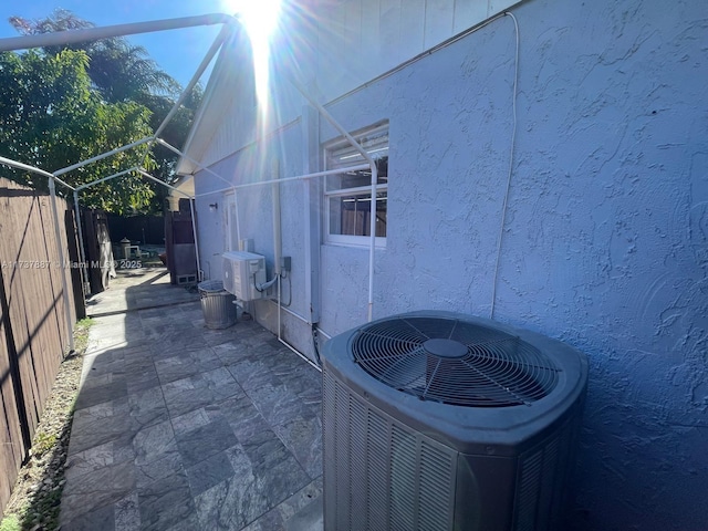 view of side of property with central AC unit