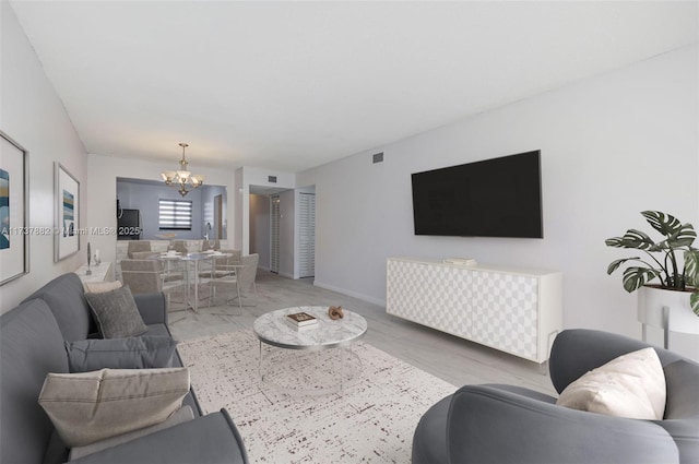 living room featuring an inviting chandelier