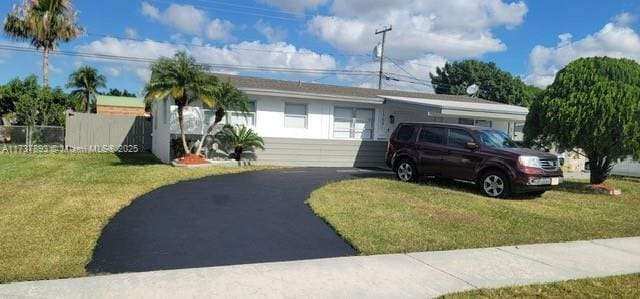 ranch-style house with a front lawn