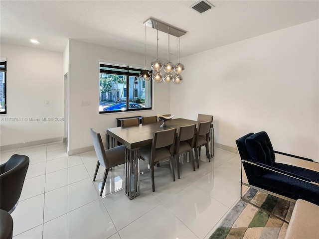 dining area with light tile patterned floors