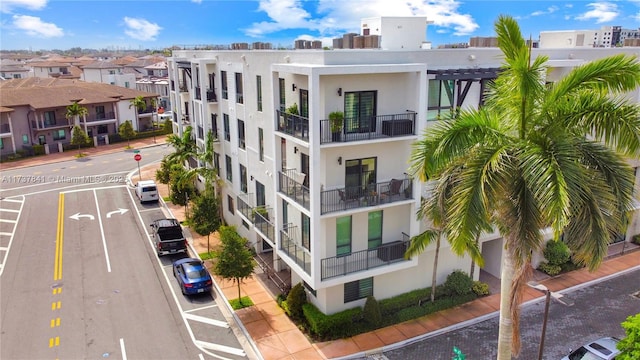 4745 NW 84th Ct Unit 15, Doral, FL 33166 - view of property featuring uncovered parking