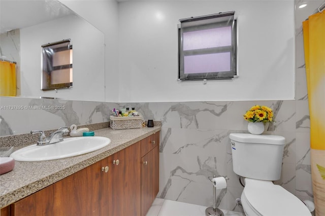 bathroom featuring vanity, tile walls, toilet, and a shower with shower curtain