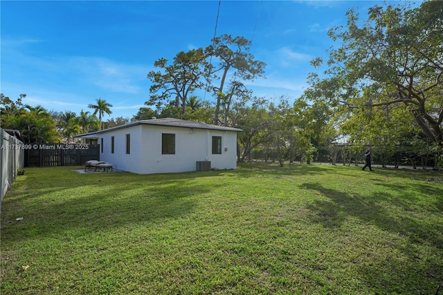 view of yard with central AC