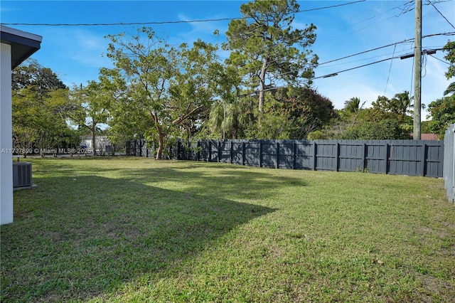 view of yard featuring central AC