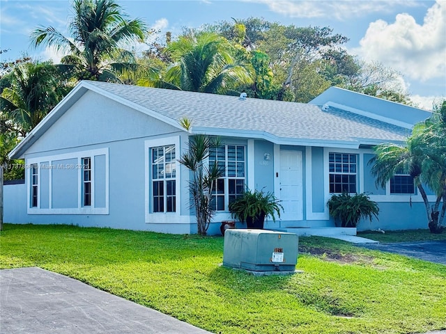 ranch-style home featuring a front yard