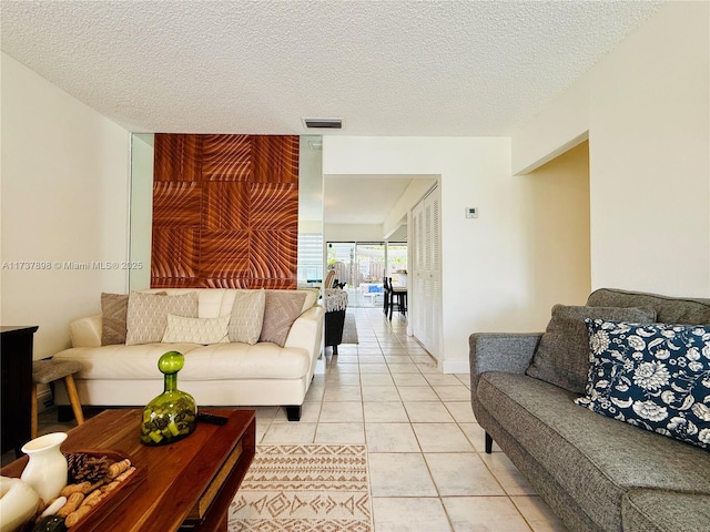 tiled living room with a textured ceiling