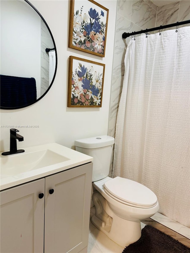 bathroom featuring vanity, toilet, and walk in shower