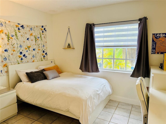 bedroom featuring light tile patterned floors