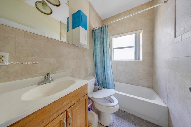 full bathroom with tile walls, vanity, shower / tub combo, and toilet