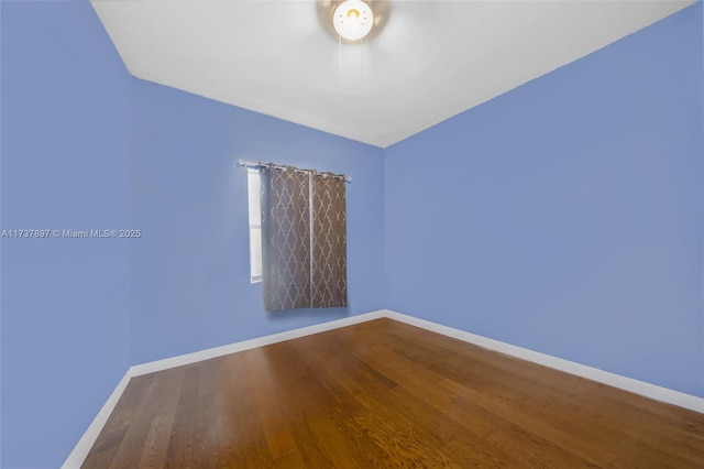 spare room featuring hardwood / wood-style floors