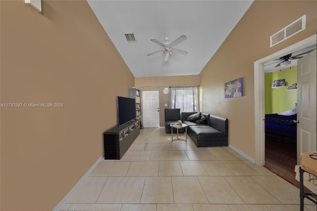 tiled living room with high vaulted ceiling and ceiling fan