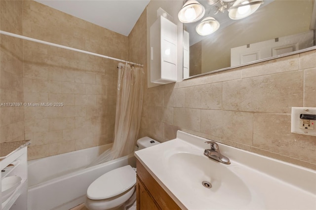 full bathroom with shower / bath combination with curtain, vanity, toilet, and tile walls