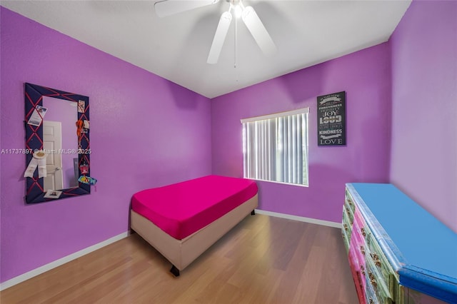 bedroom with wood-type flooring and ceiling fan