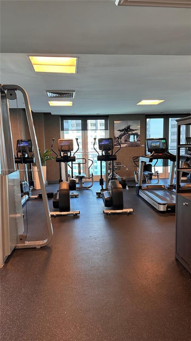 workout area featuring wood walls