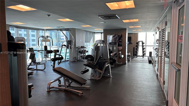 exercise room with plenty of natural light and floor to ceiling windows