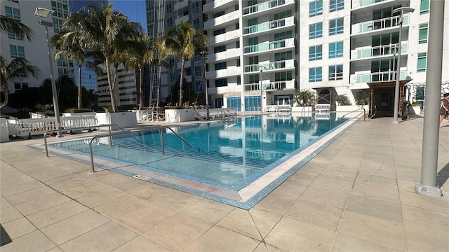 view of swimming pool with a patio area