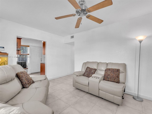 living room featuring ceiling fan and light tile patterned floors