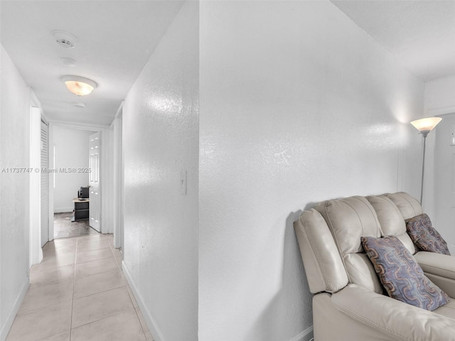 hallway with light tile patterned floors