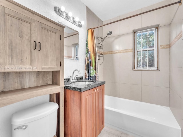 full bathroom featuring vanity, shower / bath combo, tile patterned floors, and toilet