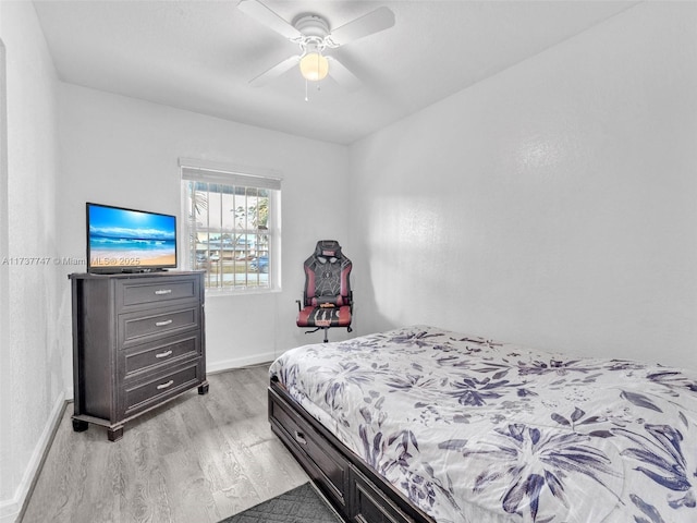 bedroom with ceiling fan and light hardwood / wood-style flooring