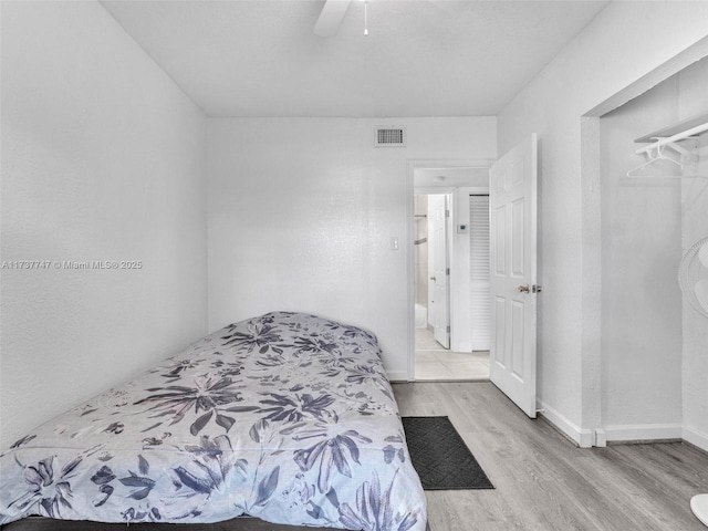 bedroom featuring ceiling fan and light wood-type flooring