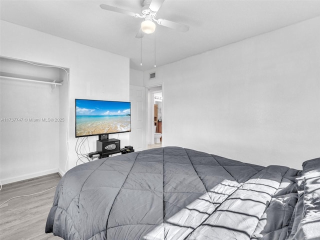 bedroom featuring wood-type flooring and ceiling fan