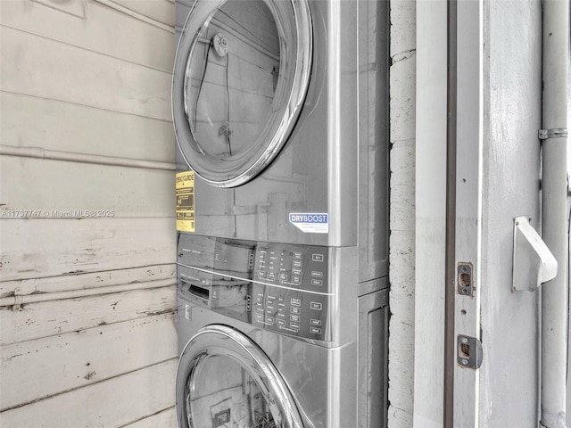 washroom featuring stacked washer and dryer