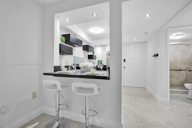 kitchen featuring a breakfast bar