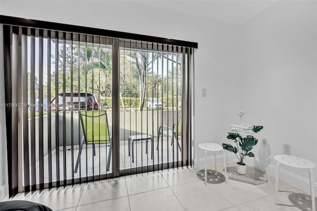 doorway featuring plenty of natural light and tile patterned flooring