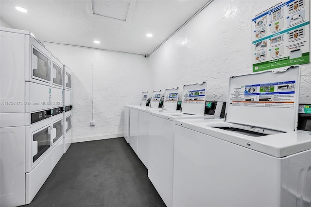 clothes washing area with stacked washer and clothes dryer and washing machine and clothes dryer