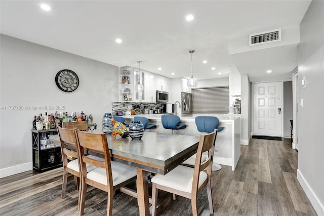 dining area featuring wood-type flooring