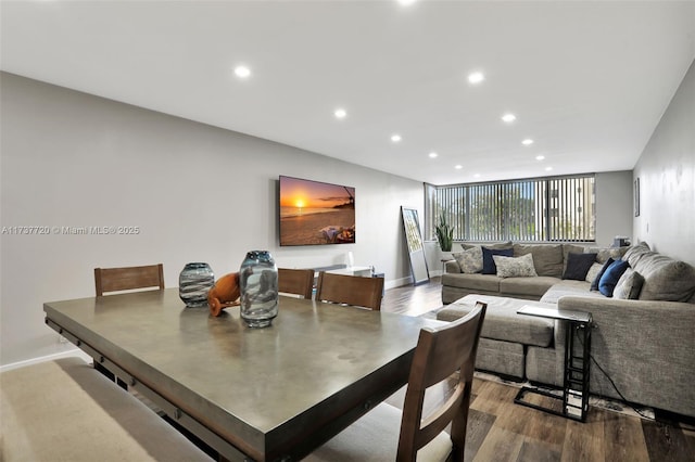 dining space featuring wood-type flooring